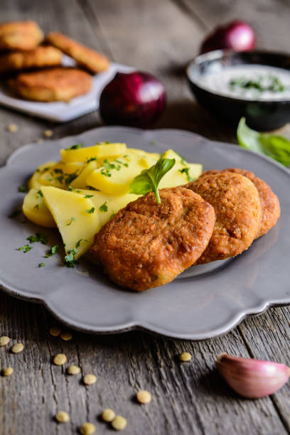 istock Vegetarian lentil burgers with potato and dip 683078606
