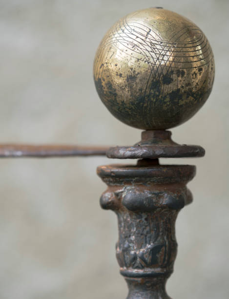 Boule, petanque, bacci ball atop a banister