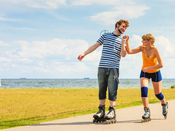 istock Young couple on roller skates riding outdoors 683086922