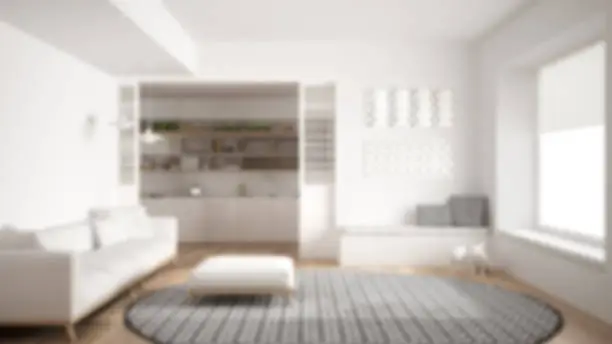 Blur background interior design, minimalist living room with sofa, big round carpet and kitchen in the background