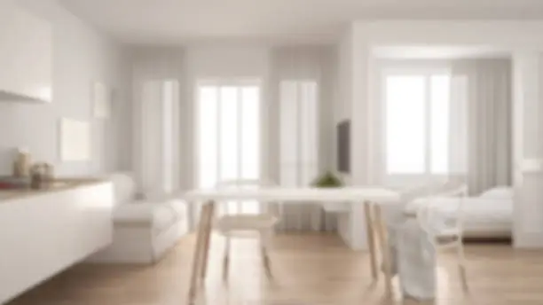 Blur background interior design, scandinavian kitchen with sofa and table, wooden parquet floor