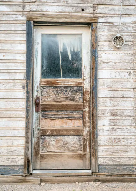 grunge door to an abandoned  house in a ghost town in Utah