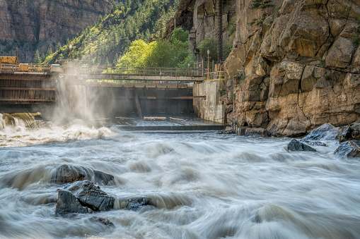 Colorado River flowing from an open gate of Shoshone Power Plant in Glenwood Canyon