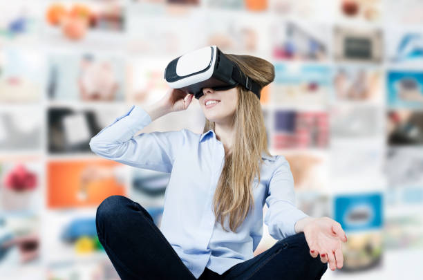 istock Woman wears virtual reality glasses with smartphone inside. 683114240