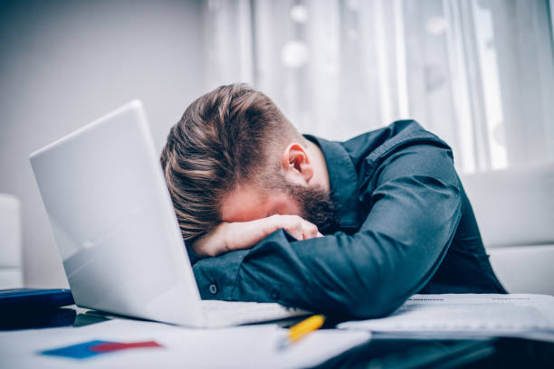 istock Young businessman getting tired and depressed working hard in the office 683118450