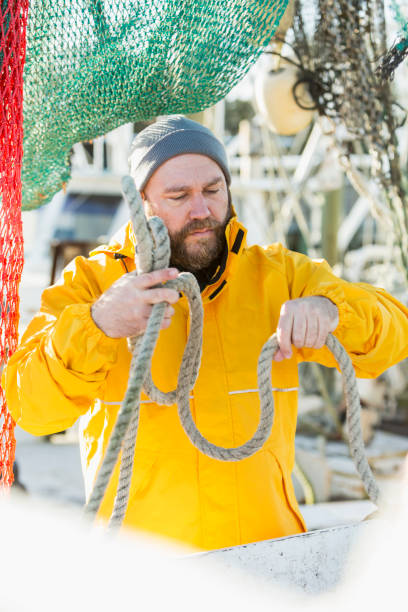 istock Man working on commercial fishing vessel 683122524