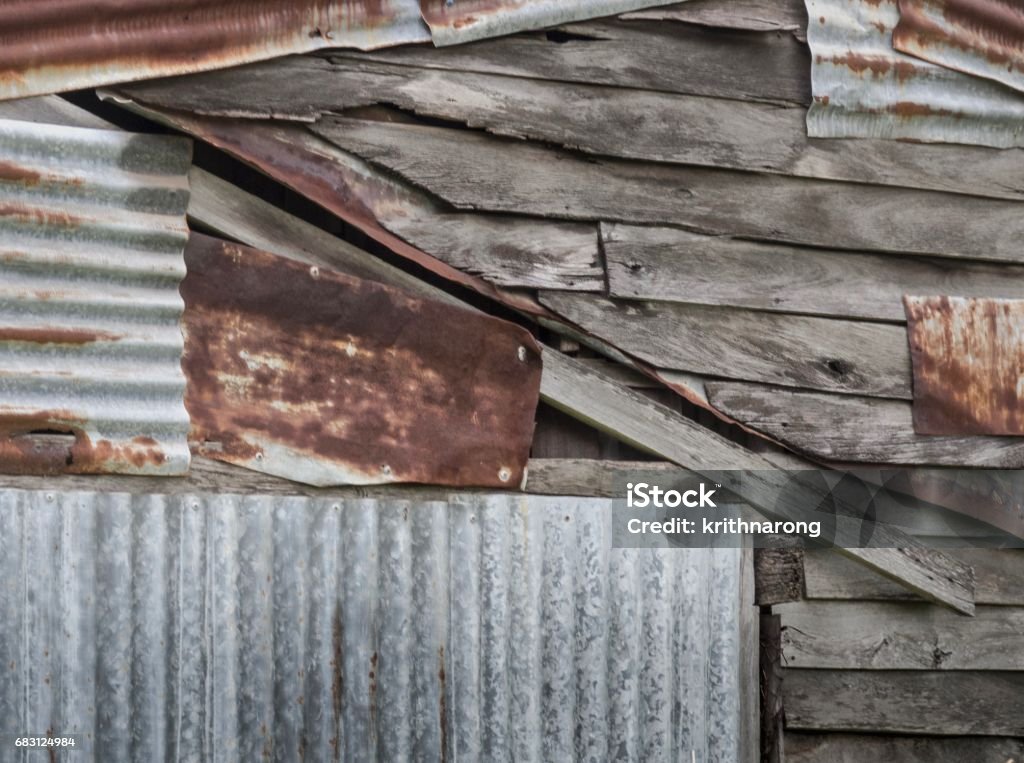 Rusty Corrugated Metal Sheets On Old Wooden Wall Background Stock Photo -  Download Image Now - iStock