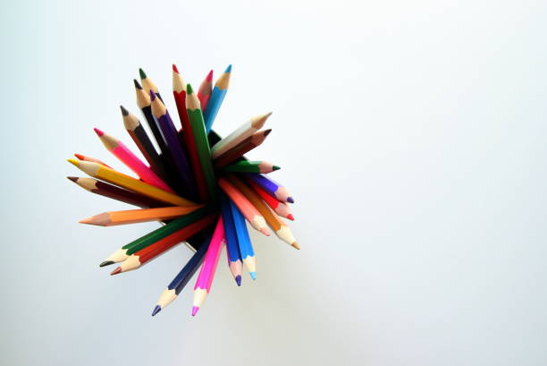 istock A lot of colored pencils inside a tin can on the white background. 683142924