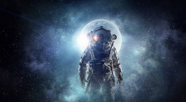 Astronaut in outer space. Mixed media stock photo