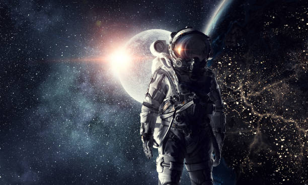 Astronaut in outer space. Mixed media stock photo