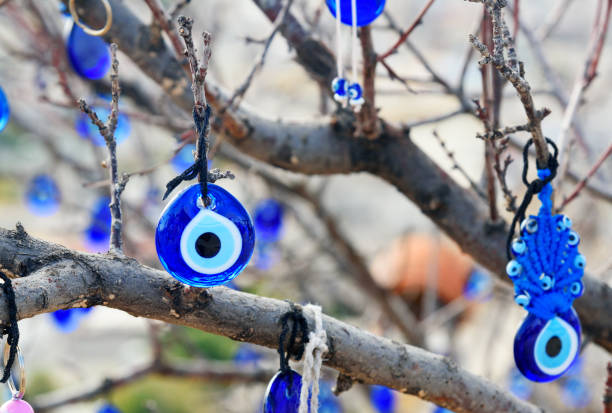 istock Nazars, Turkish Evil eye charms on the tree. Goreme. Cappadocia. Turkey 683155886