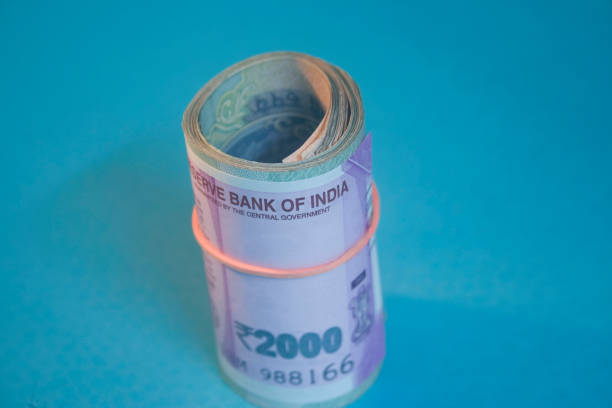 istock indian 2000 rupee, Indian 2000 Rs Currency notes rolled with rubber bands 683159128