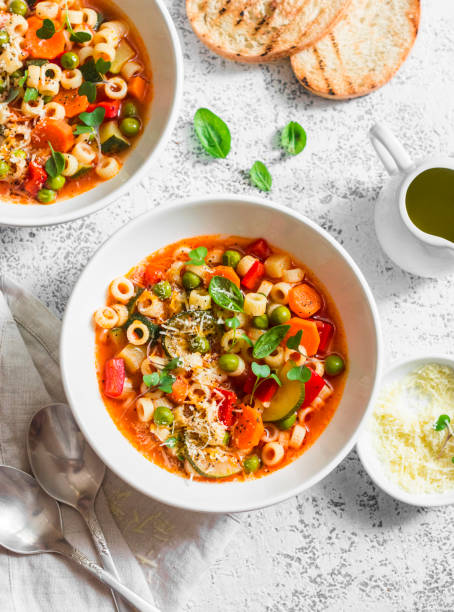 istock Vegetarian minestrone - delicious healthy mediterranean lunch. On a light table, flat lay 683159306
