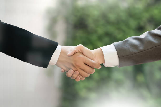 istock M&A (MERGERS AND ACQUISITIONS) , Businessman handshake working at office M&A 683166388