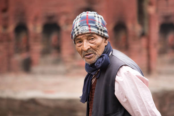 Kathmandu, Nepal - Apr 15, 2016: An elderly man participating in a traditional ceremonial procession.