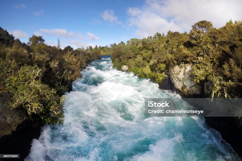 Wild rushing stream of Huka Falls New Zealand Wild rushing stream of Huka Falls near Lake Taupo in the North Island of New Zealand Authority Stock Photo