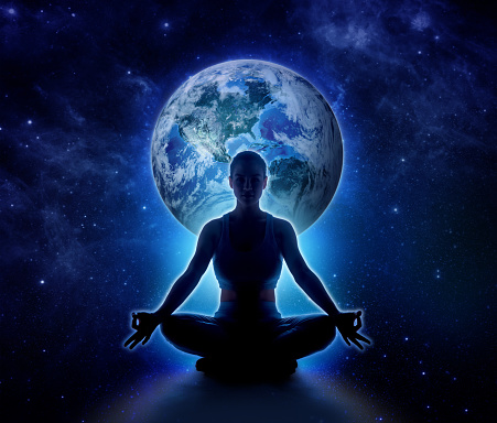 Yoga woman on the world. Meditation girl itting in lotus pose on planet earth and star in dark night sky, Moon original image from NASA.gov