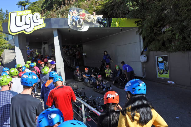 People line up to Skyline Rotorua Luge ride Rotorua: People line up to Skyline Rotorua Luge ride. Skyline Luge is a gravity fuelled fun ride. Invented in New Zealand in 1985, and having hosted over 30 million rides worldwide. rotorua luge stock pictures, royalty-free photos & images