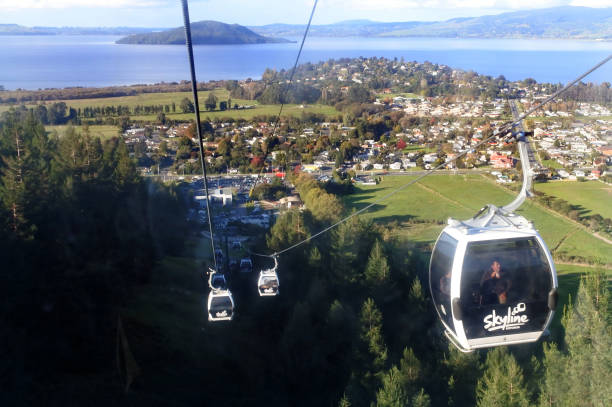 Skyline Gondola Cableway Rotorua New Zealand Rotorua: Visitors ride on the Skyline Gondola Cableway in Rotorua, North Island, New Zealand. rotorua luge stock pictures, royalty-free photos & images