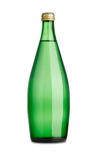 Soda water in sealed green glass bottle on white background