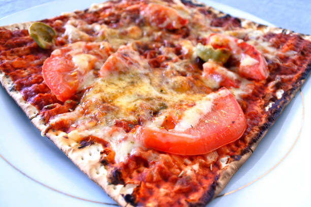 Matzo pizza Matzo pizza. Passover Jewish food. matzo stock pictures, royalty-free photos & images