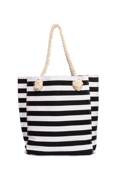 istock Beach striped handbag isolated on white 683181282