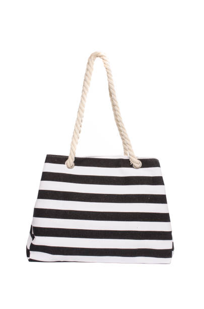 istock Beach striped handbag isolated on white 683181304