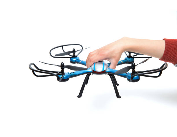 istock Holding a quadrocopter drone isolated on white background 683182328