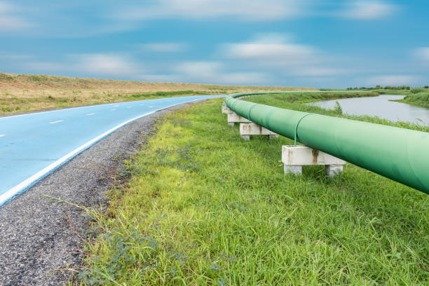 istock Raw water pipeline and distribution parallel of the road. 683194864