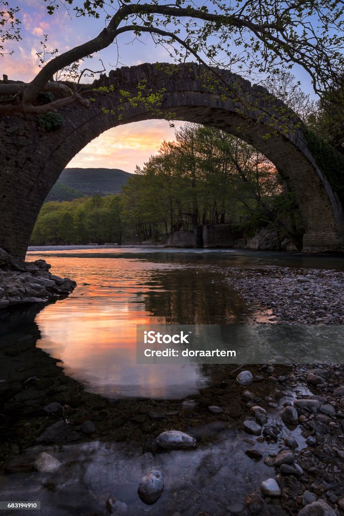Blind Sunset Sunset in old bridge of Voidomatis river,  Epirus Greece Bridge - Built Structure Stock Photo