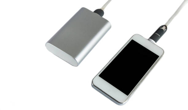 istock Charging smartphone with grey power bank ( portable external battery ) isolated on a white background 683194962