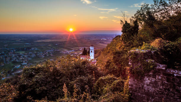 istock Sunset from a hill with a church down to the vineyards 683201350
