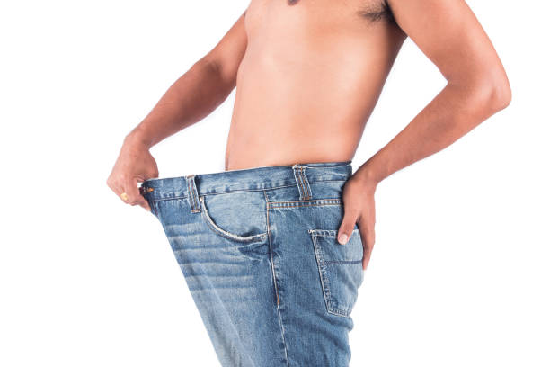 istock Young man show body after weight loss 683201954