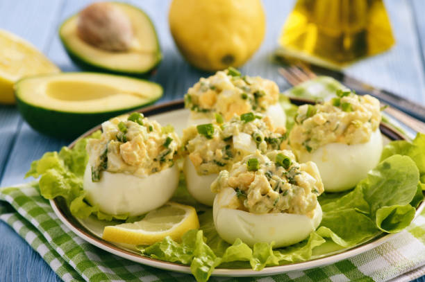istock Stuffed eggs with avocado, garlic and leek. 683204918