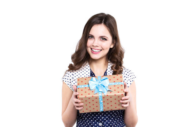 istock Happy woman holding gift present, isolated. 683207604