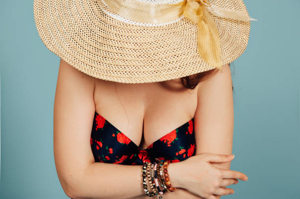 istock Summer girl covers her face with big hat 683207806