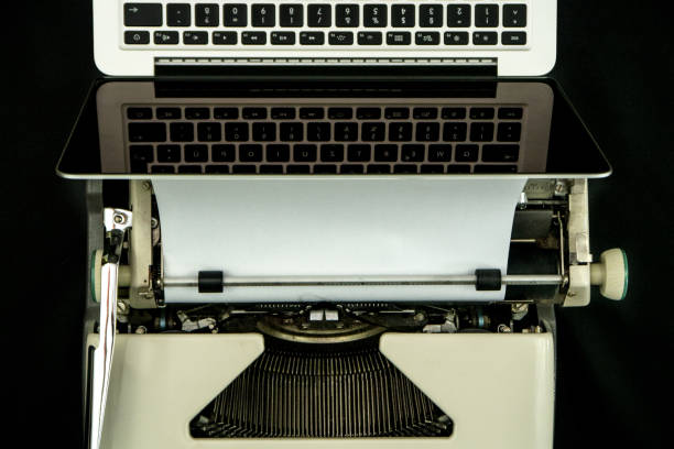 istock Overhead Shot of old typewriter and modern laptop, technological progress concept 683211820