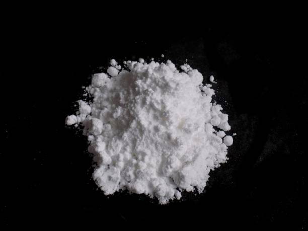istock Cocaine drug powder pile on black background 683214812