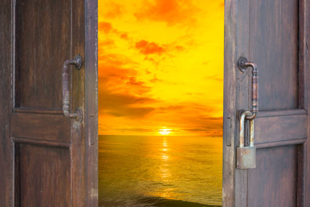 istock abstract old wood window open to sea with sunset scene 683214980