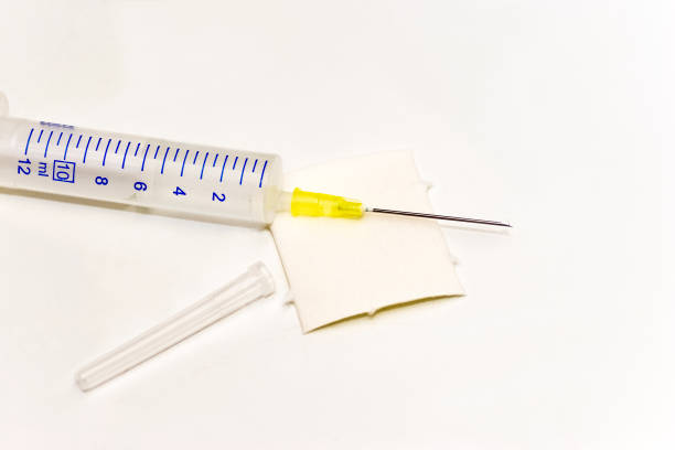 Close up of a Syringe with a Swab