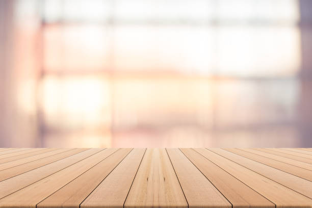istock table top on blurred background,Space available for the product,Warm natural light from the window 683221048