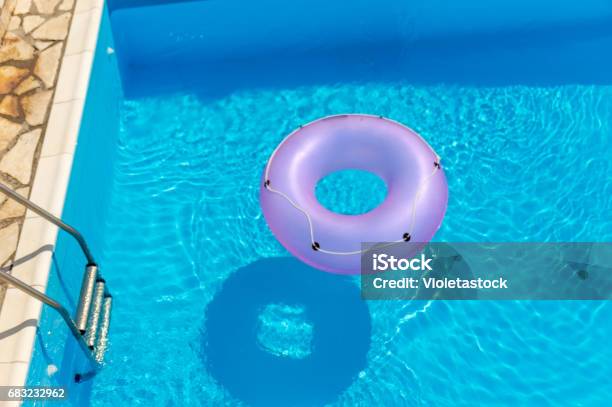 Rubber Ring In The Swimming Pool - Fotografias de stock e mais imagens de Piscina - Piscina, Plástico, Anel - Joia