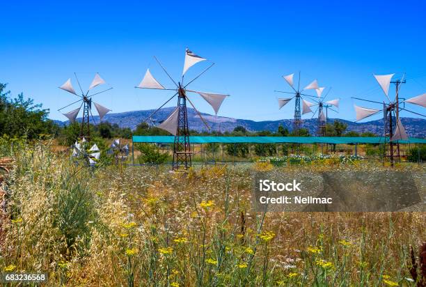 Old Rusty Windmills On The Field Agriculture In Greece Crete Stock Photo - Download Image Now