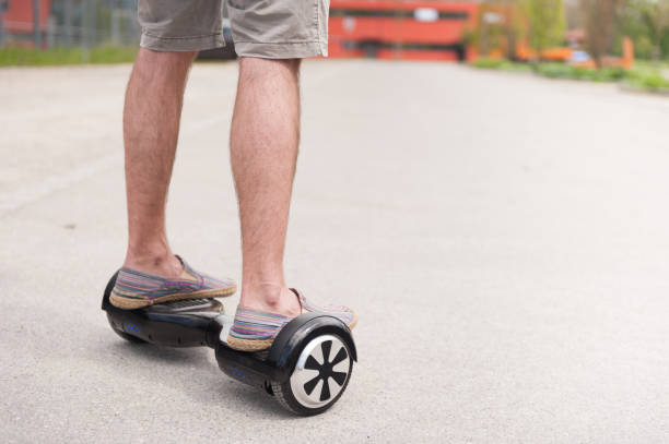 istock Feet of a man driving hoverboard 683244228