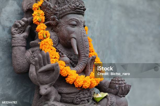 Ganesha With Balinese Barong Masks Flowers Necklace And Ceremonial Offering Stock Photo - Download Image Now
