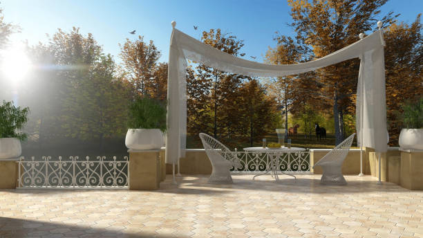 istock Empty classic terrace with canopy relax area, armchairs and table for breakfast, panoramic autumn garden and grazing horses 683250044