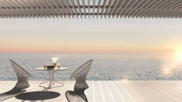 Minimalist modern terrace with relax area, armchairs and table for breakfast, panoramic sea ocean, sunset sunrise