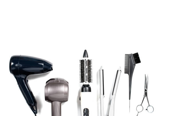 istock Various hair styling devices on white background, top view 683257910