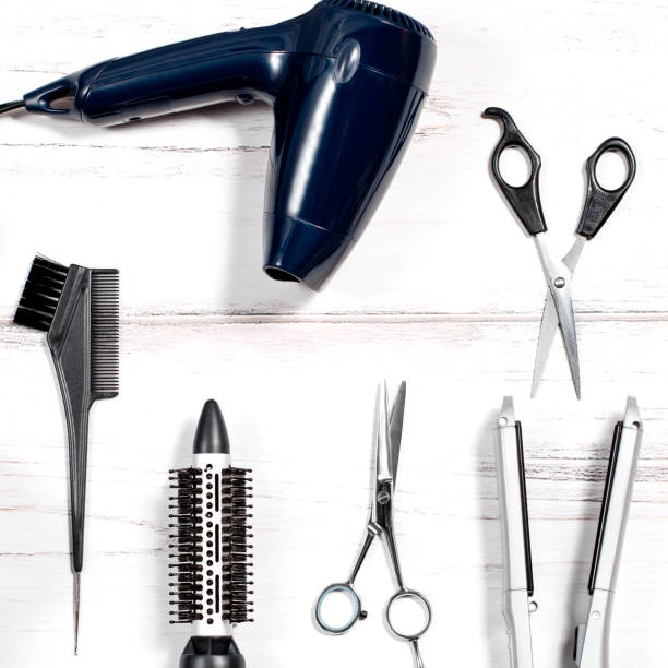 istock Various hair styling devices on white background, top view 683257912