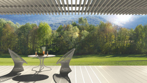 istock Minimalist modern terrace with relax area, armchairs and table for breakfast, panoramic garden meadow 683257970